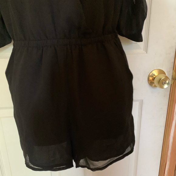 Black cross front one piece long sleeve - Picture 2 of 3